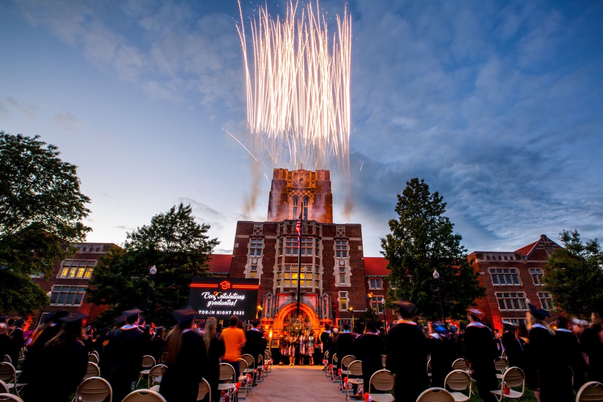 Fireworks explode over Ayres Hall at a University of Tennessee commencement ceremony